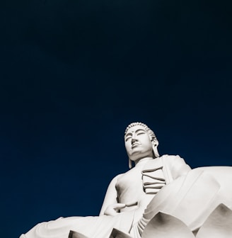 white concrete statue under blue sky during daytime