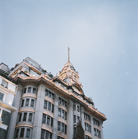 brown concrete building under blue sky during daytime in Guangzhou China