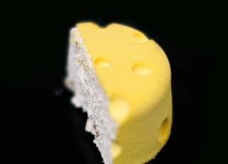 yellow and white cake on black surface