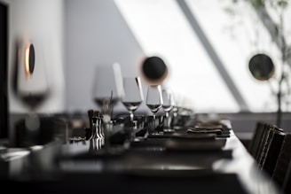 black and white ceramic mugs on table