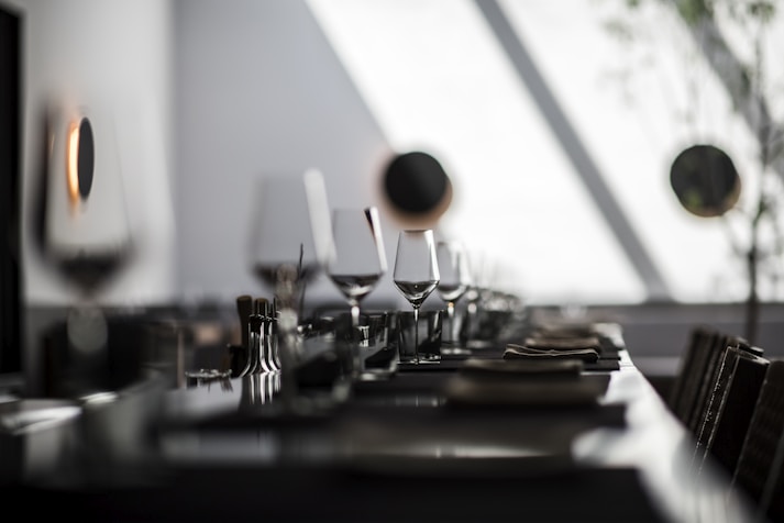 black and white ceramic mugs on table