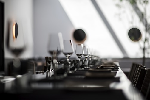 black and white ceramic mugs on table