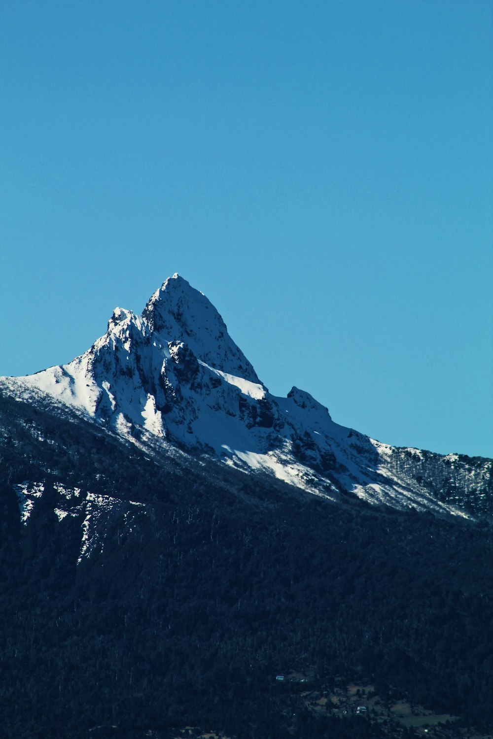 snow covered mountain under blue sky during daytime