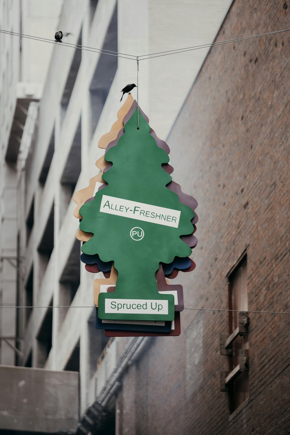 a sign hanging from the side of a building