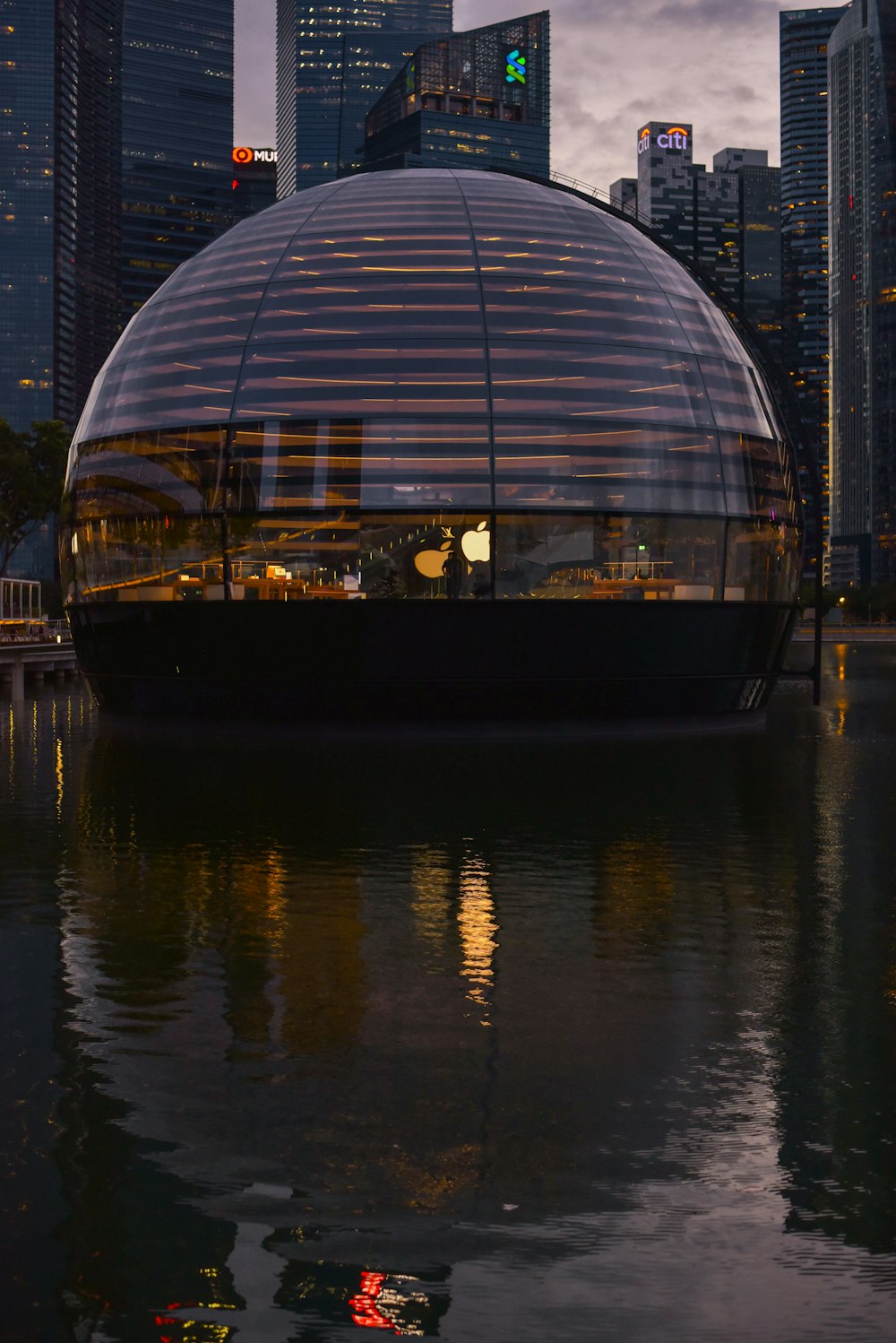 clear glass dome building on water during daytime