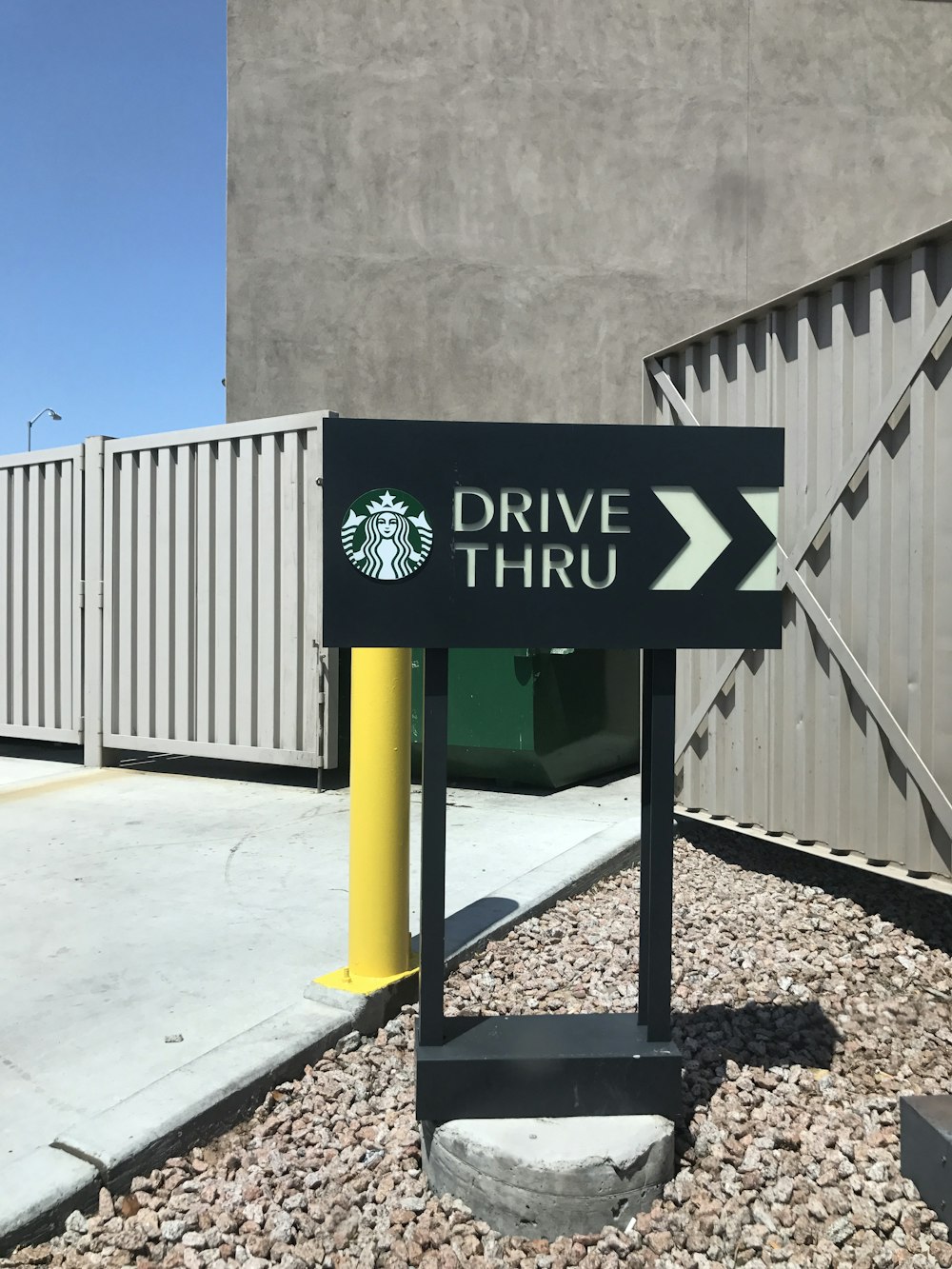 green and white wooden signage