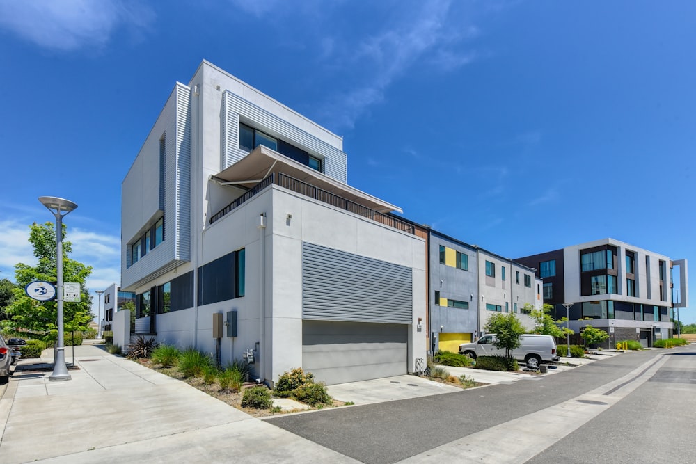 white and blue concrete building under blue sky during daytime