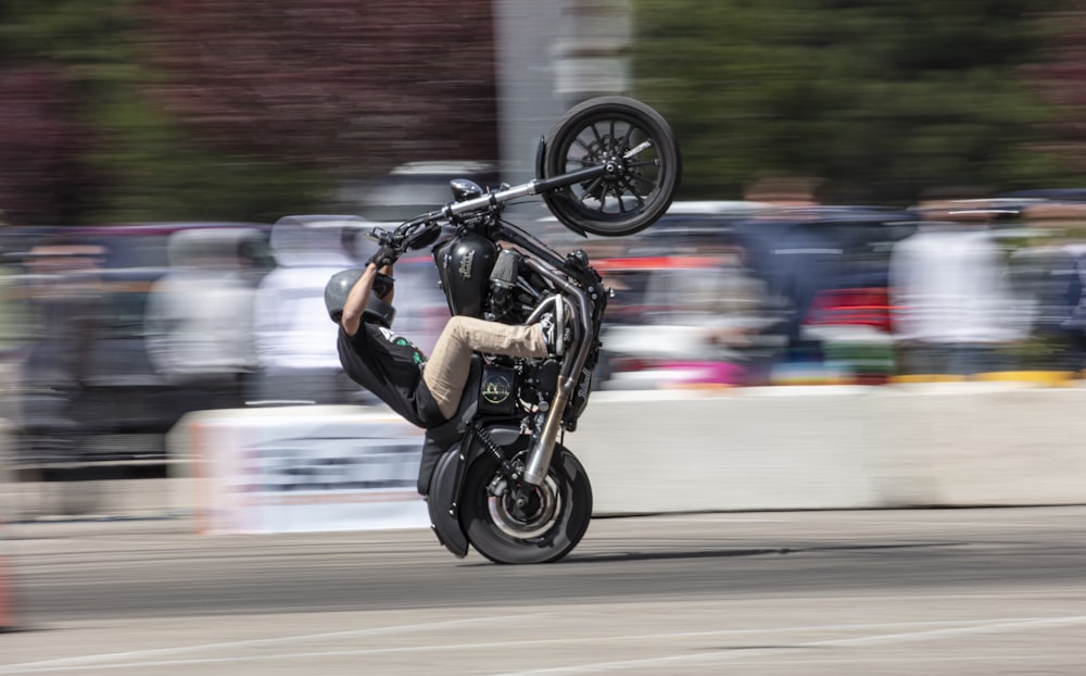 man in black jacket riding motorcycle