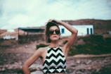 woman in black and white stripe tank top wearing black sunglasses
