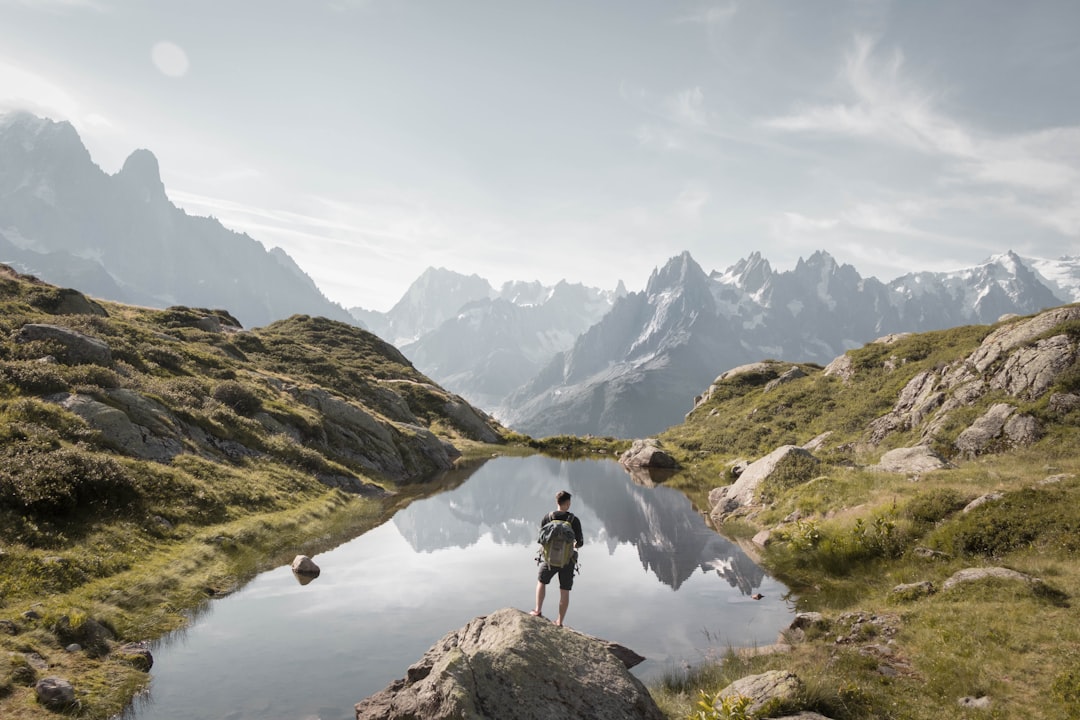 person standing on rock mountain during daytime, Hiking to Lac Blanc gives the best views ❤️<p></figure>More on Instagram: @clem.i ✨