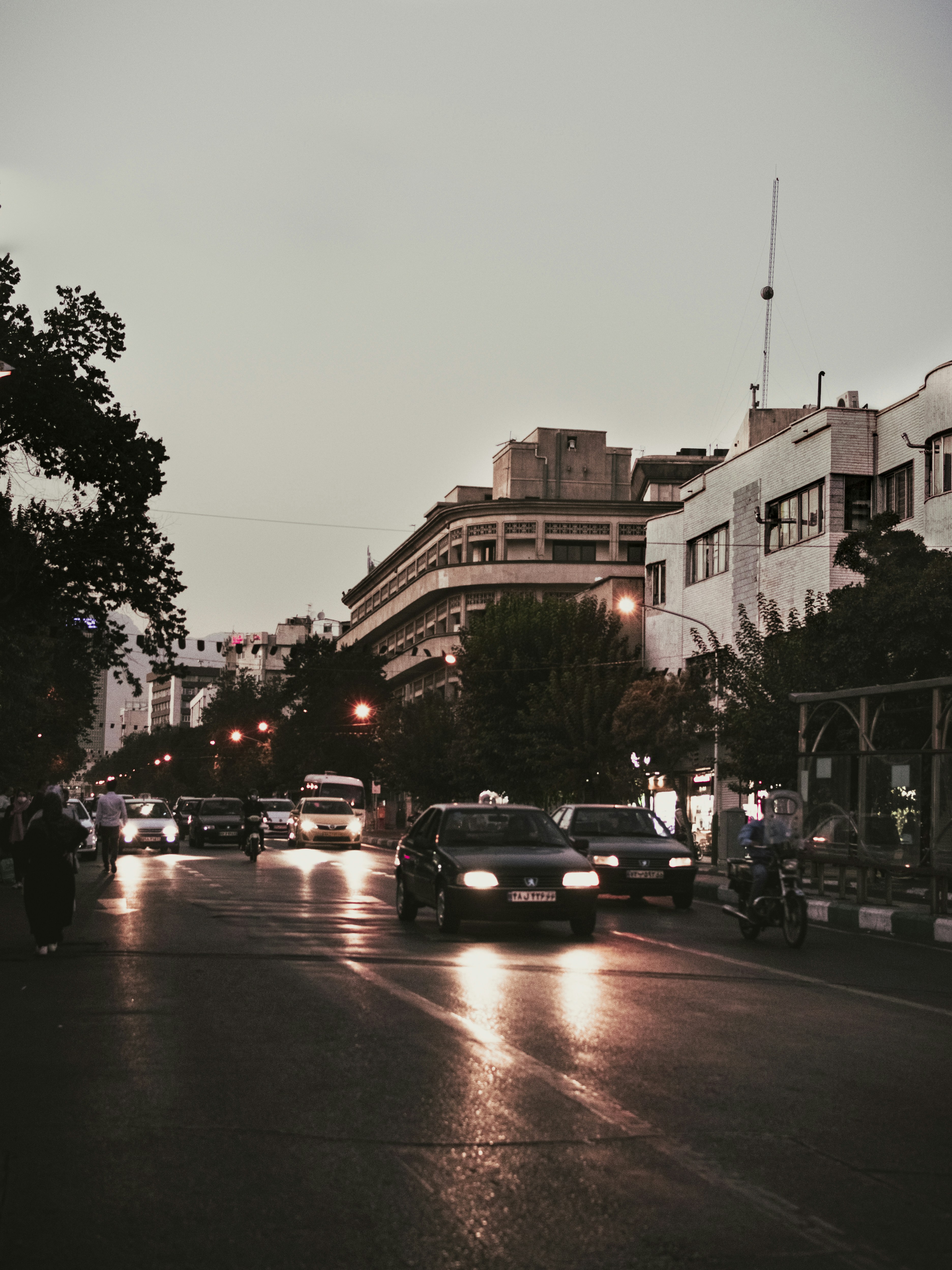 cars parked on side of the road during sunset