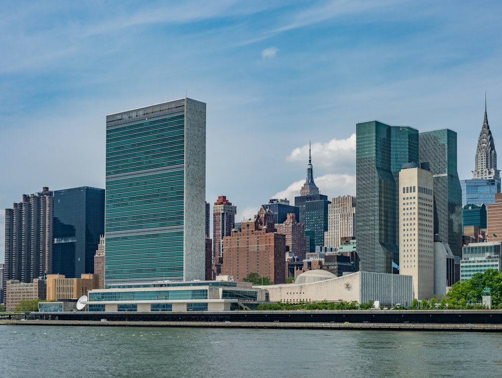 city buildings near body of water during daytime