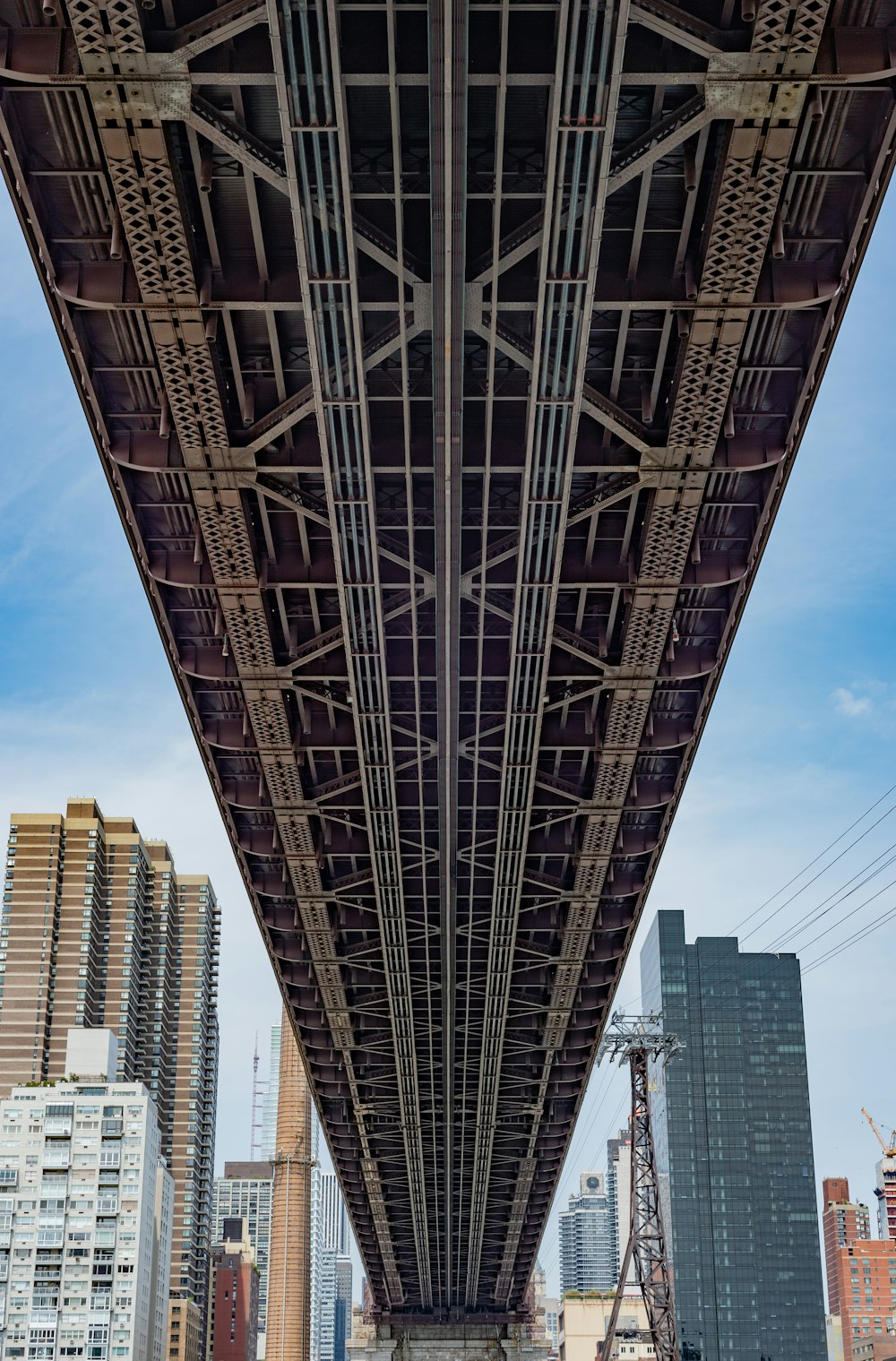 gray metal bridge under blue sky during daytime