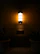 A dimmable wall sconce casting warm, gentle light over a stylish reading nook.