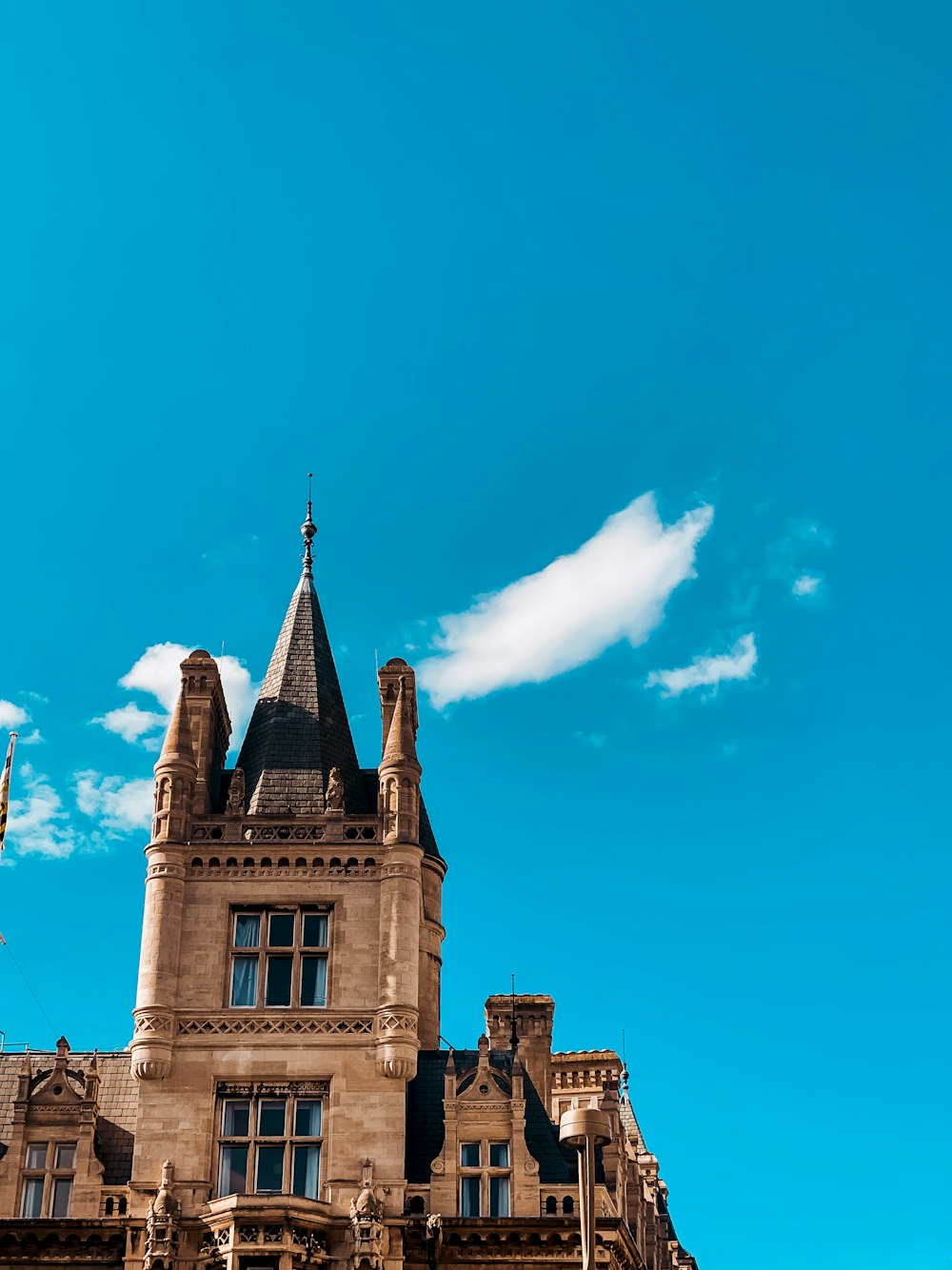 brown concrete building under blue sky during daytime