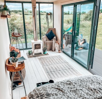 brown wooden chair near glass sliding door