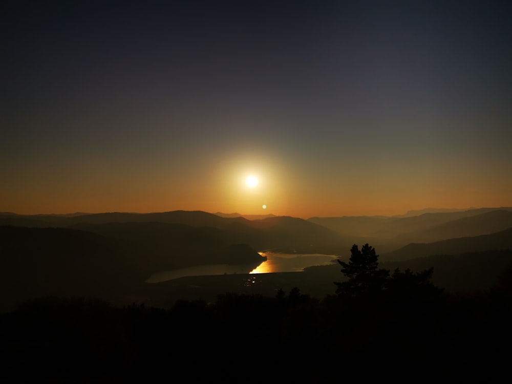 sun setting over the mountains