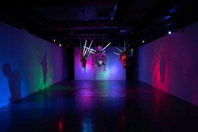 An abstract installation combining light, color, and technology in a modern gallery space.
