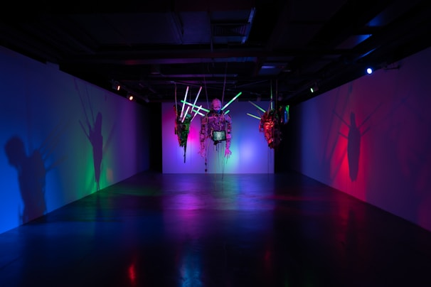 A vibrant mixed-media installation blending sculpture and digital art at musée moed.