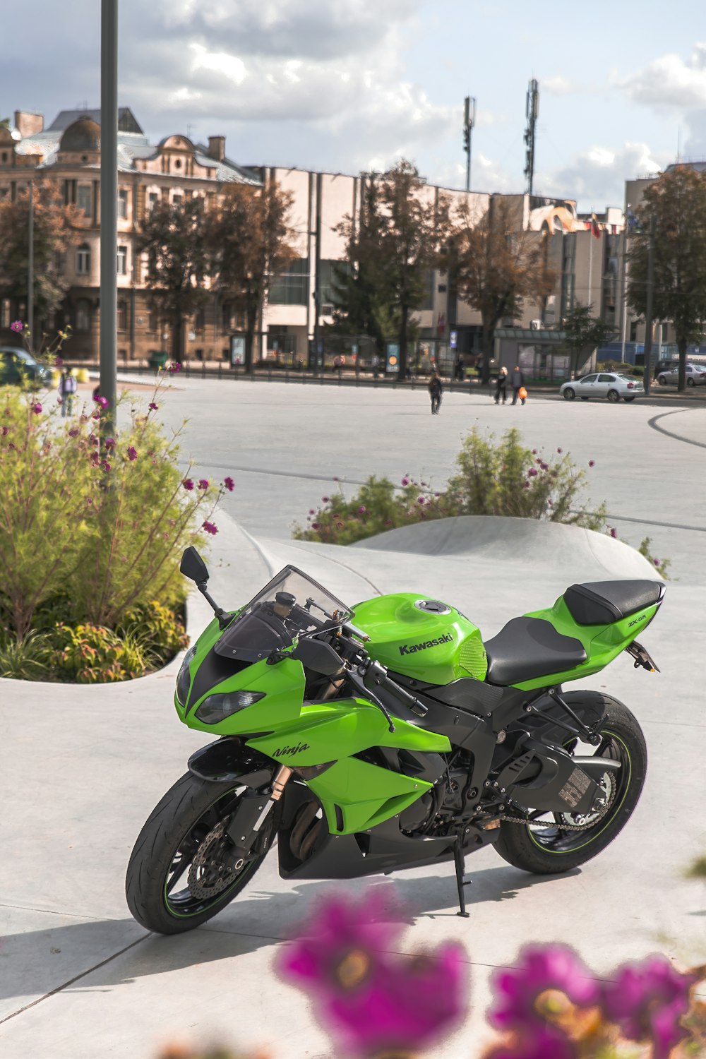 green and black sports bike on road during daytime