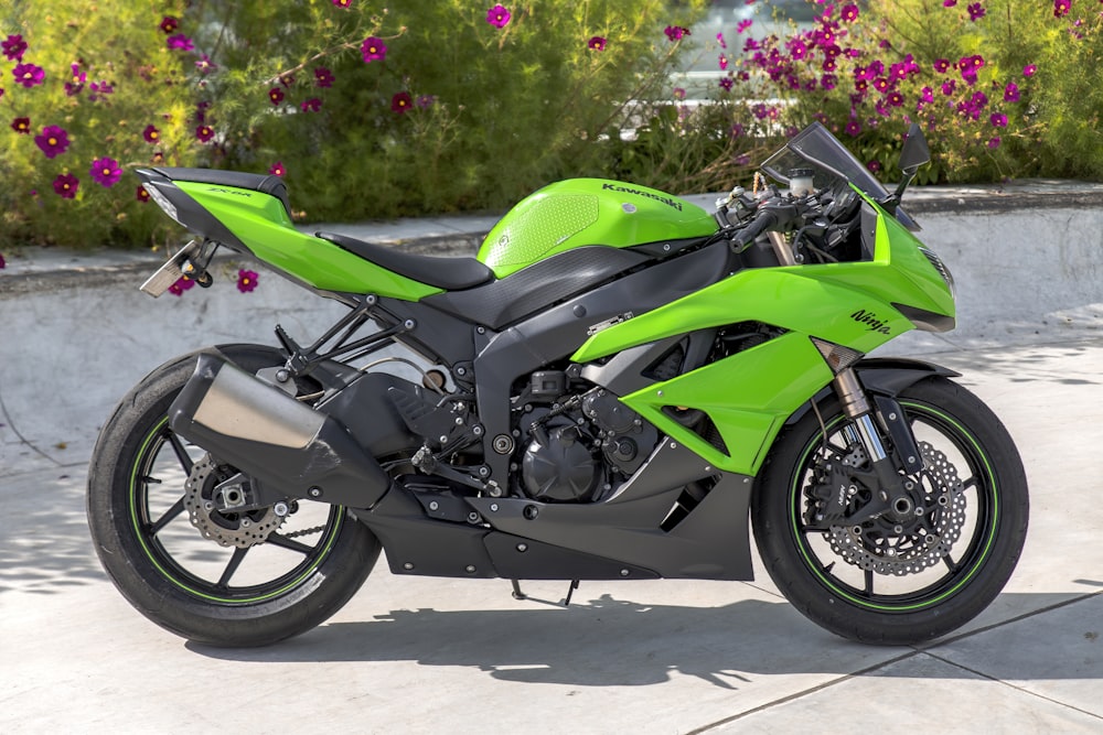 green and black sports bike