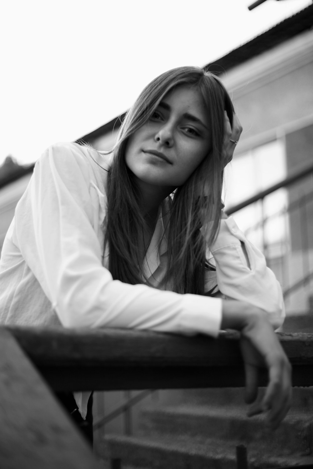 grayscale photo of woman in white long sleeve shirt