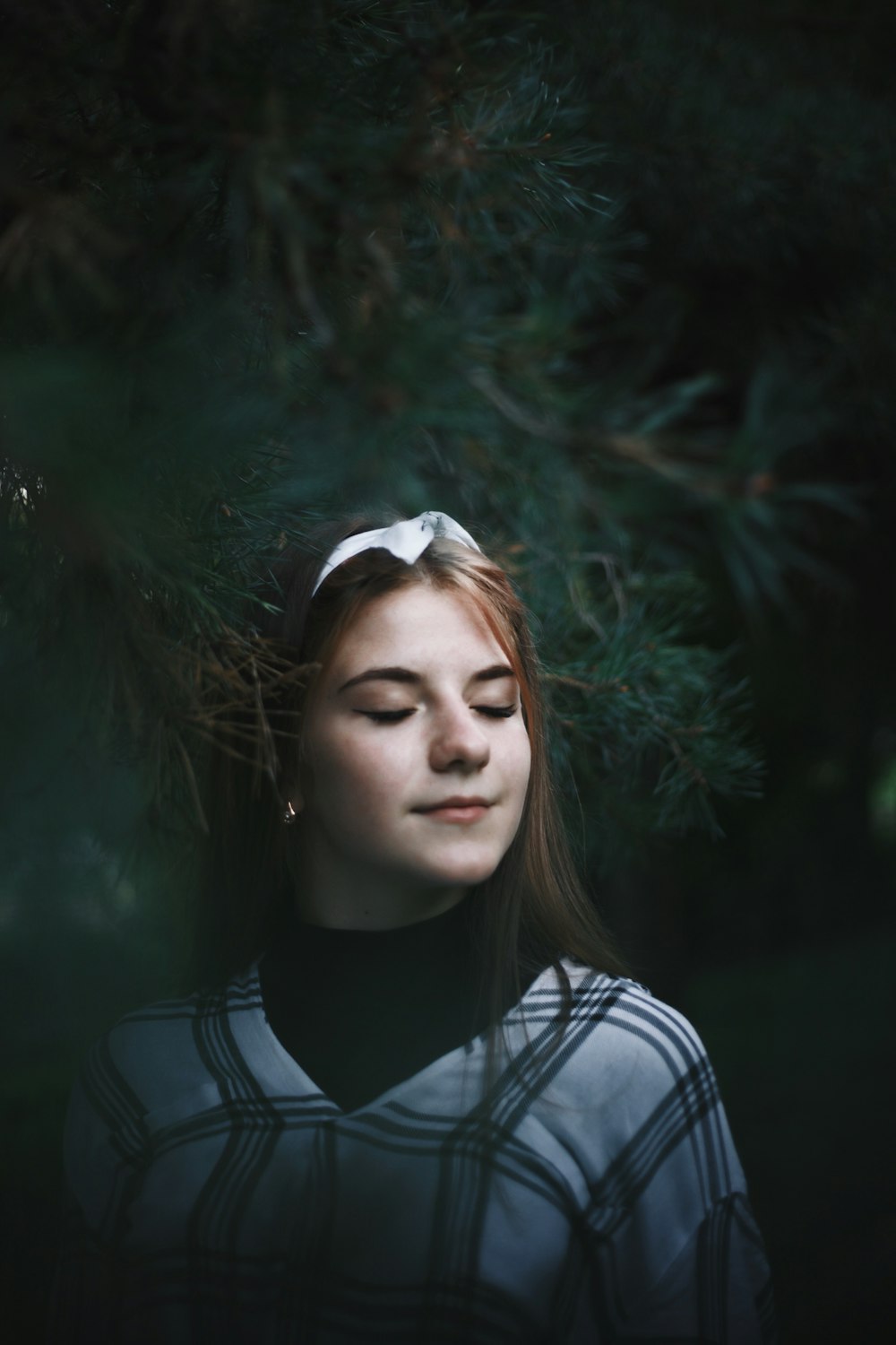 woman in white and black striped shirt