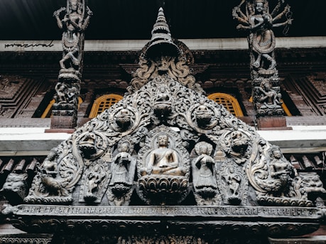 A beautifully carved wooden mandir with intricate detailing and a smooth finish.