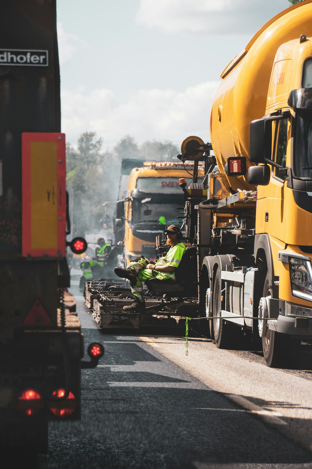 yellow and black heavy equipment on road during daytime