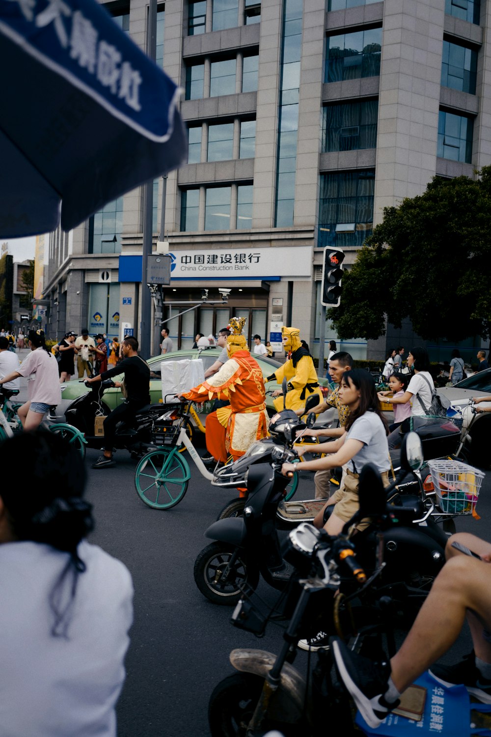 people riding motorcycle on street during daytime