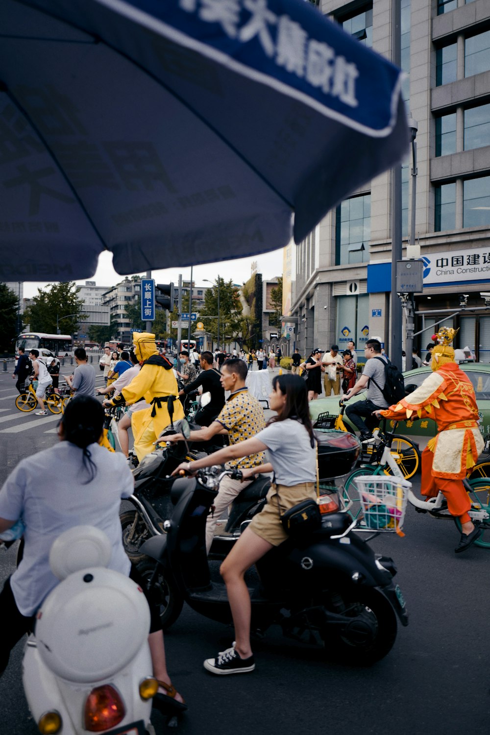 people riding motorcycle on road during daytime