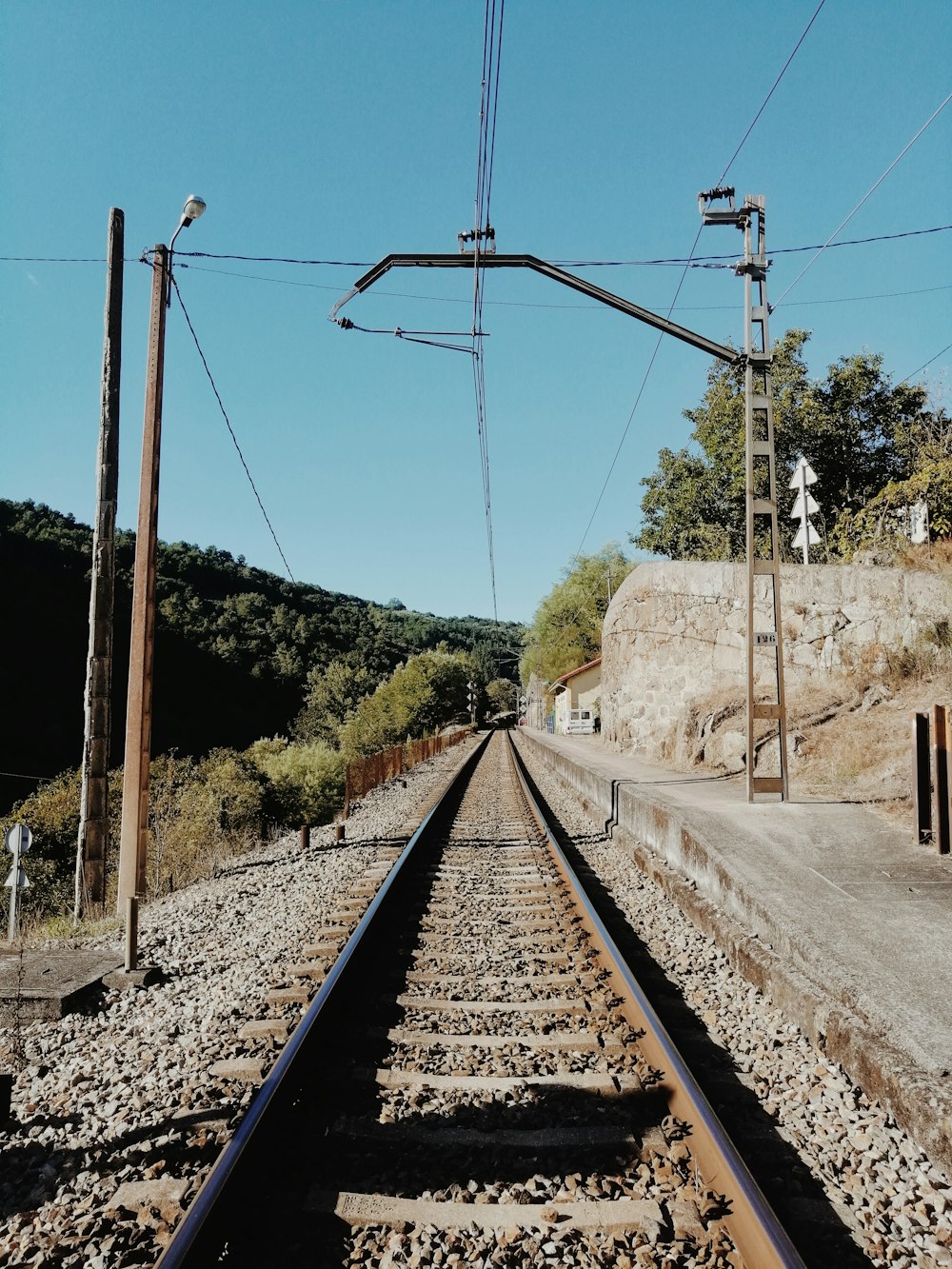 brown metal train rail during daytime