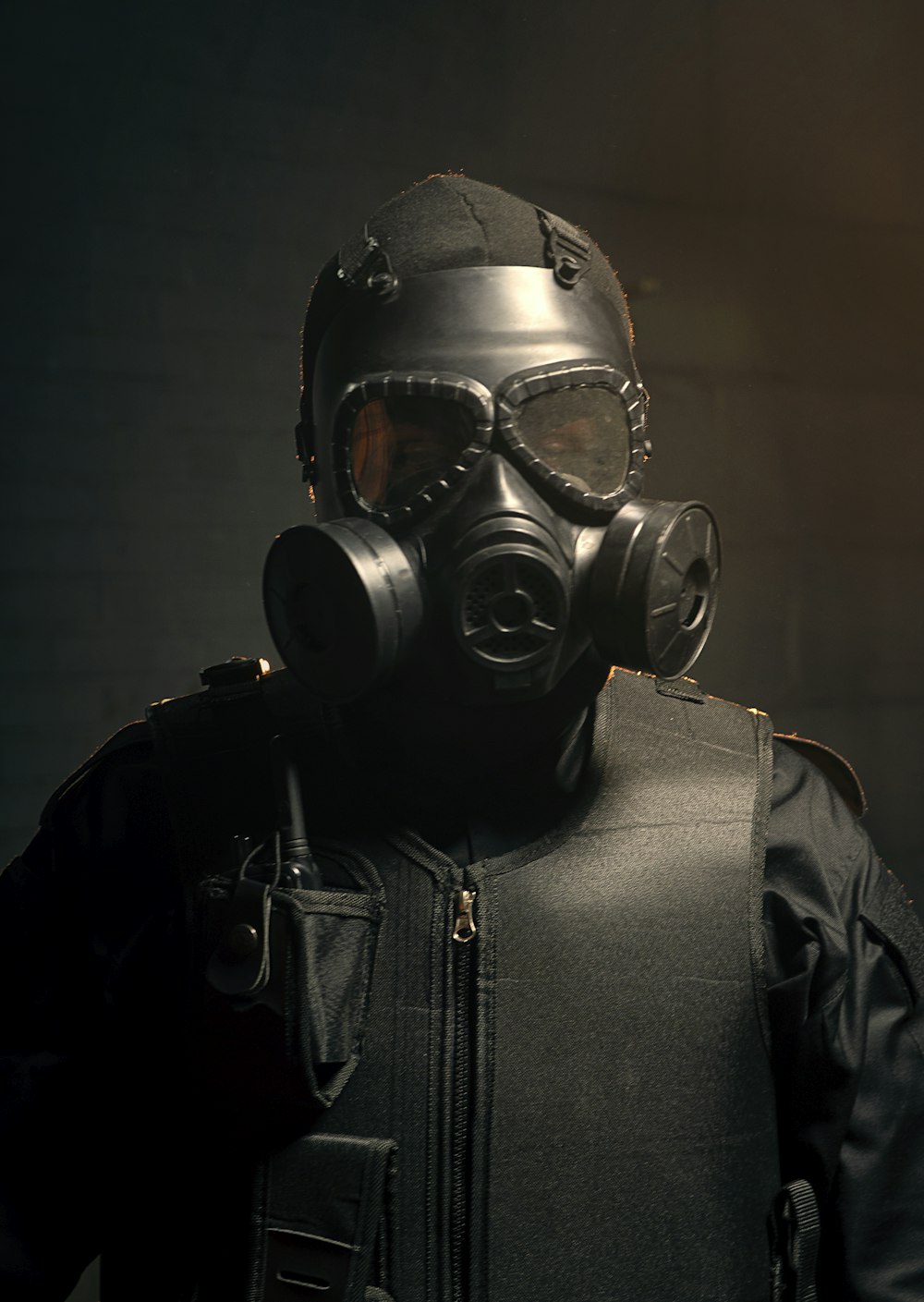 man in black leather jacket wearing gas mask