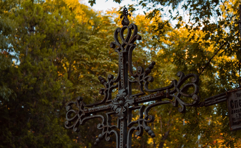 black cross with yellow leaves