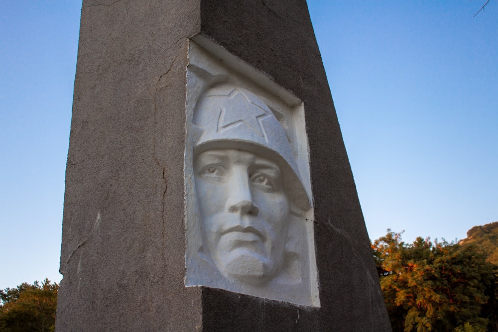 gray concrete statue of man