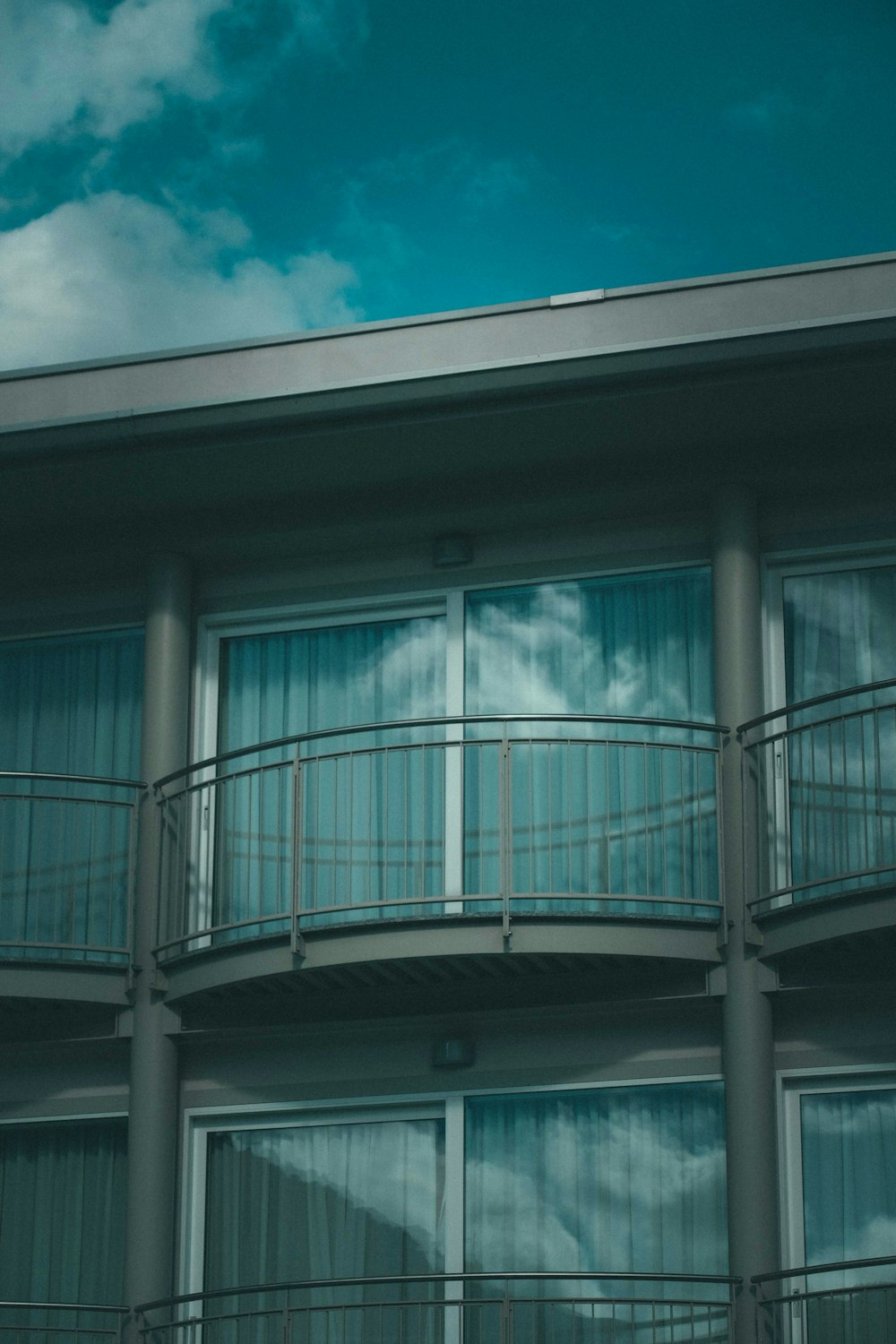 white and blue concrete building under blue sky during daytime