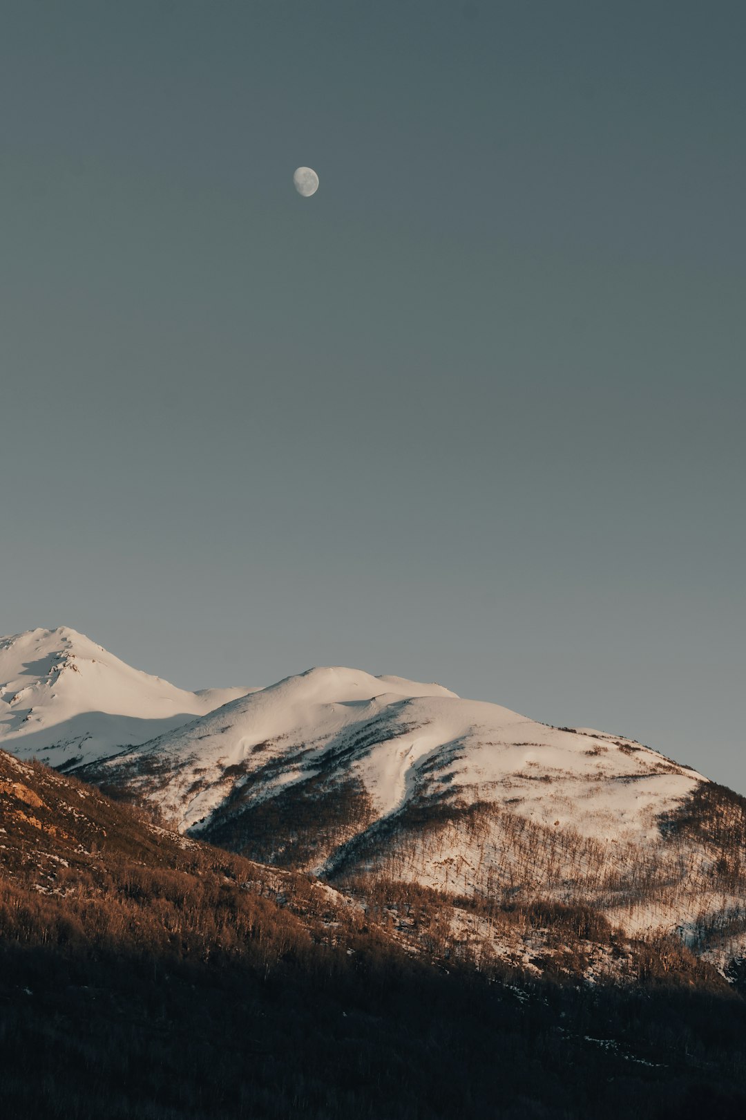 snow covered mountain under blue sky during daytime