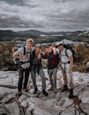 Joyful friends enjoying a scenic mountain hike together.