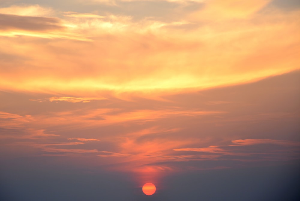 orange and grey clouds during sunset