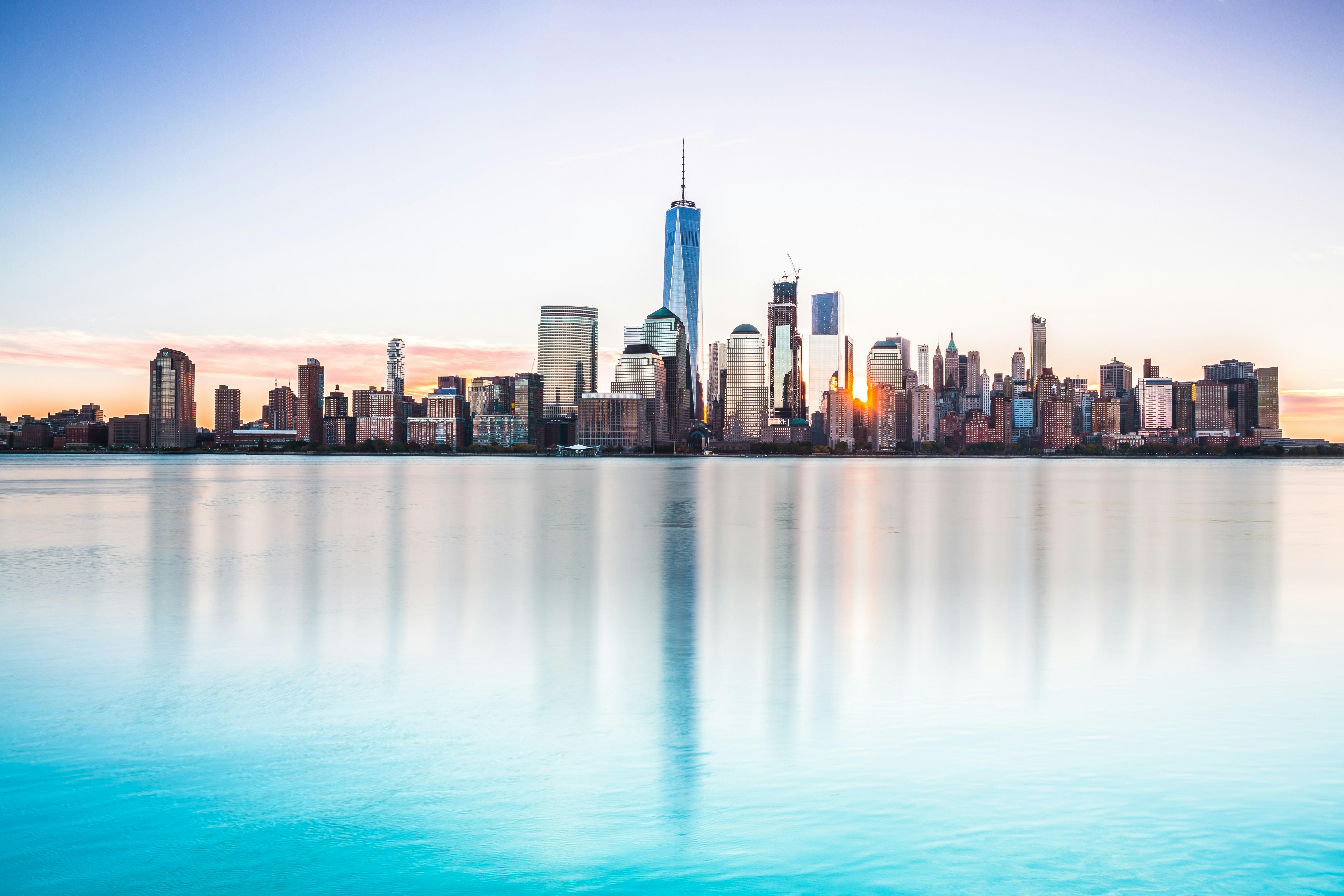 City skyline across body of water during daytime photo – Free Sunrise Image  on Unsplash, image size:3000x2000