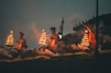 people sitting on brown wooden bench during night time