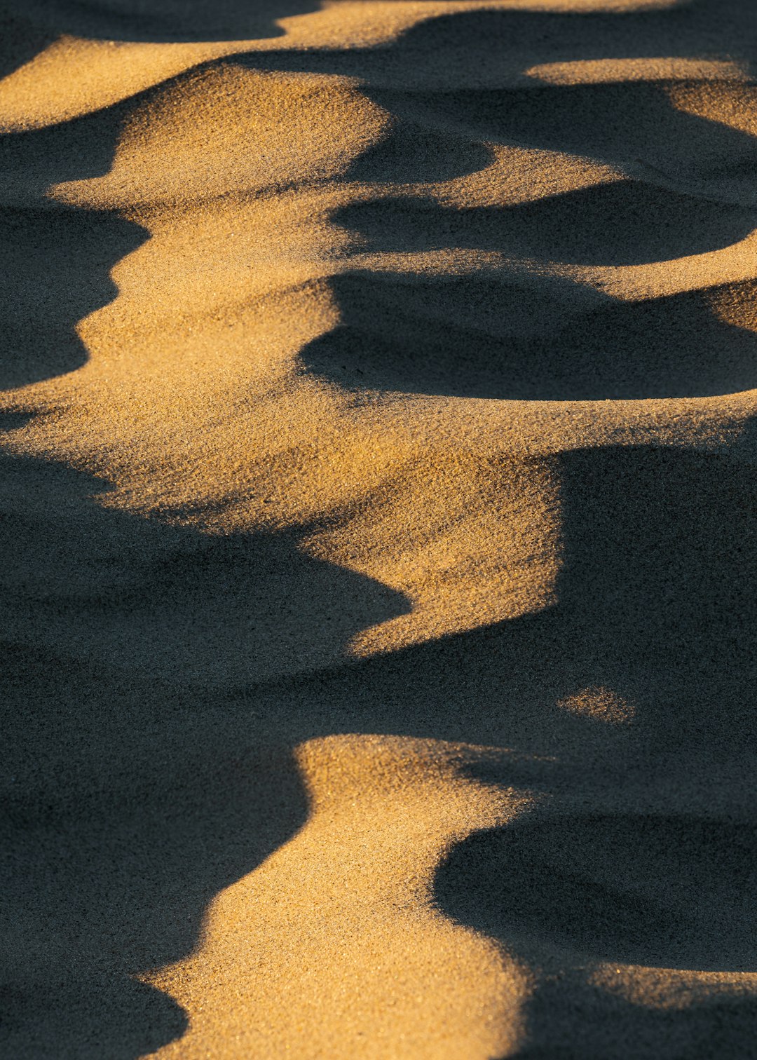 brown sand with shadow of person