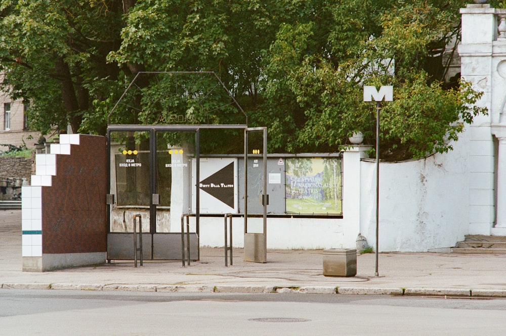 white and brown concrete building near green trees during daytime