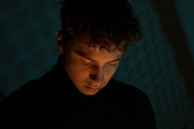 Elegant hairstyle showcasing soft curls and shine under warm lighting.