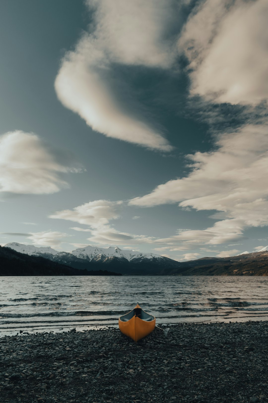 person in orange kayak on sea during daytime