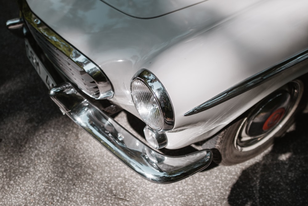 silver car on gray concrete floor