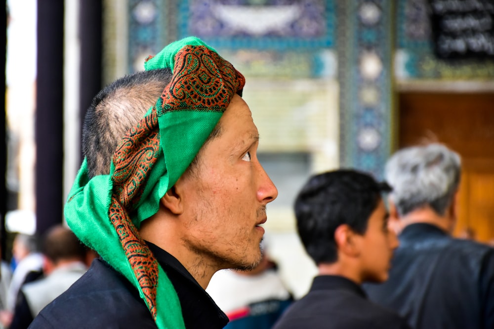 woman in green and brown hijab
