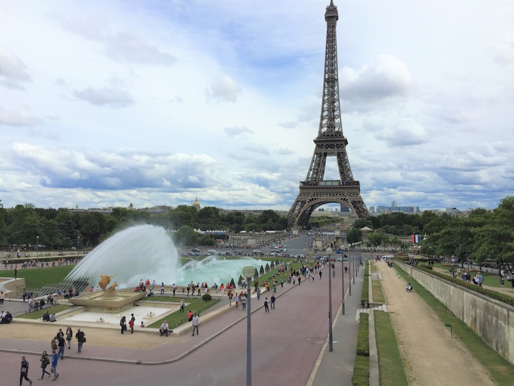 people walking on the street near eiffel tower during daytime