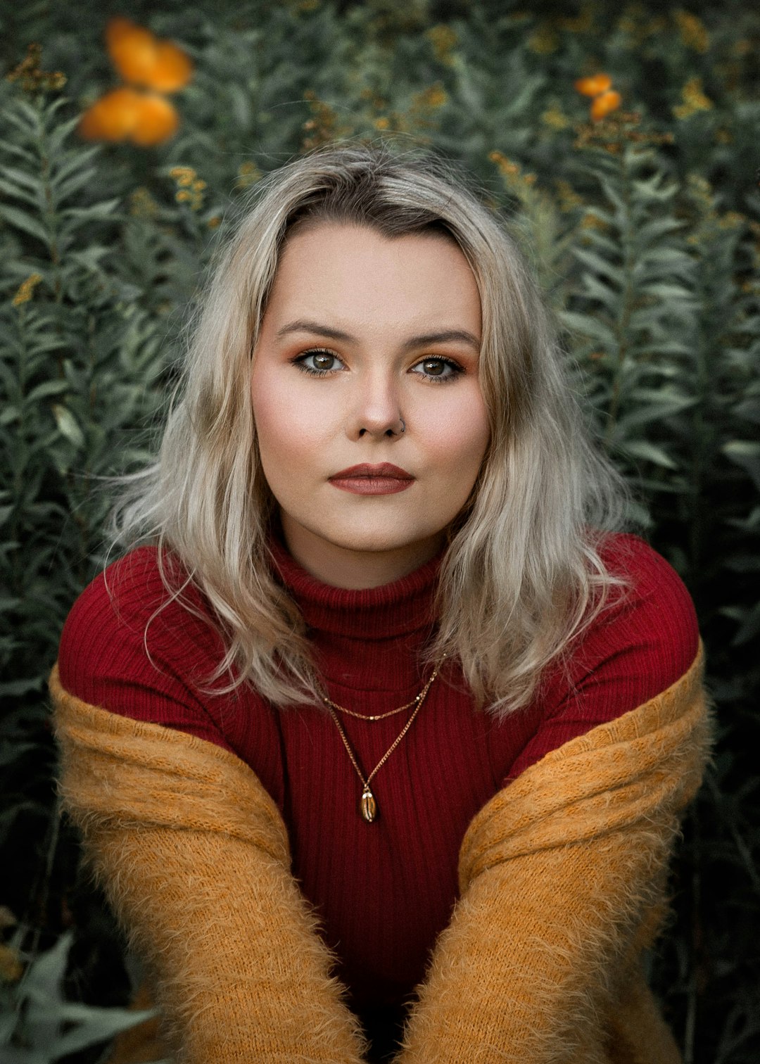 girl in red and brown sweater