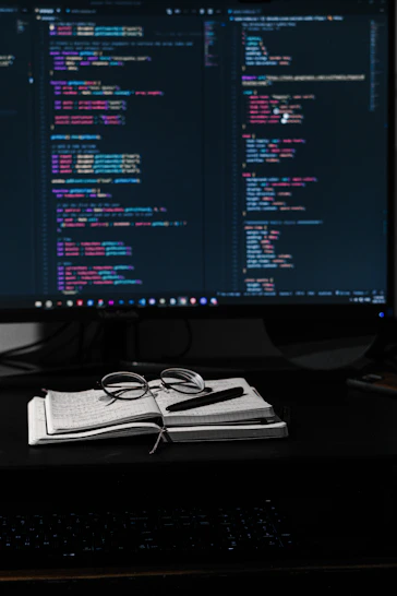 A bright, clean workspace with a laptop displaying the vivanexa landing page.